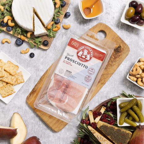 A delightful table with a pack of Prosciutto, offering a feast for the eyes with its vibrant and appetizing presentation.