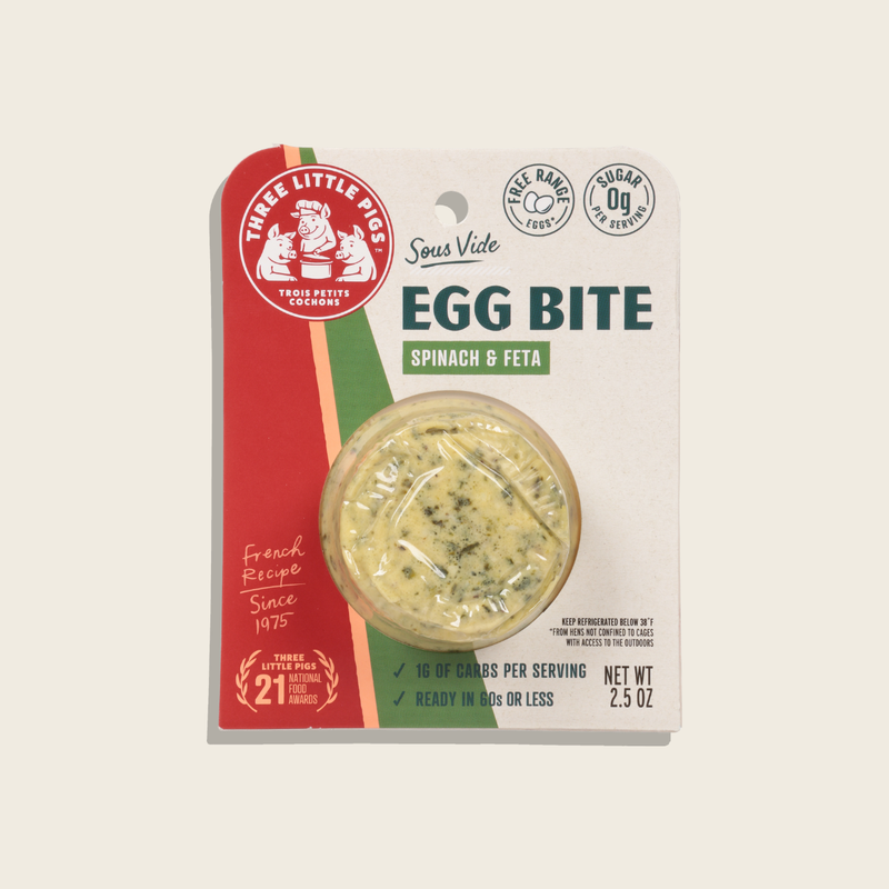 Packaged spinach and feta egg bite with brand logo on a light gray background
